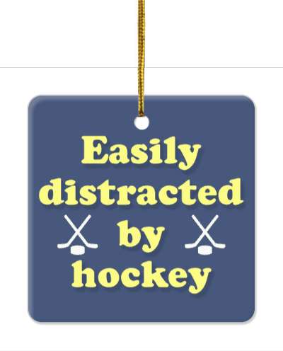 easily distracted by hockey crossed sticks puck blue pale yellow stickers, magnet